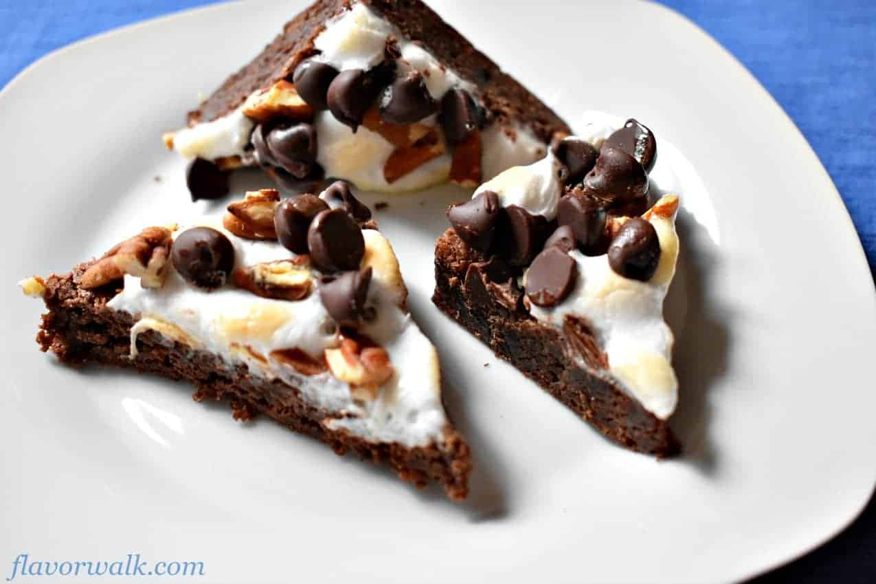 Three rocky road brownies on white plate