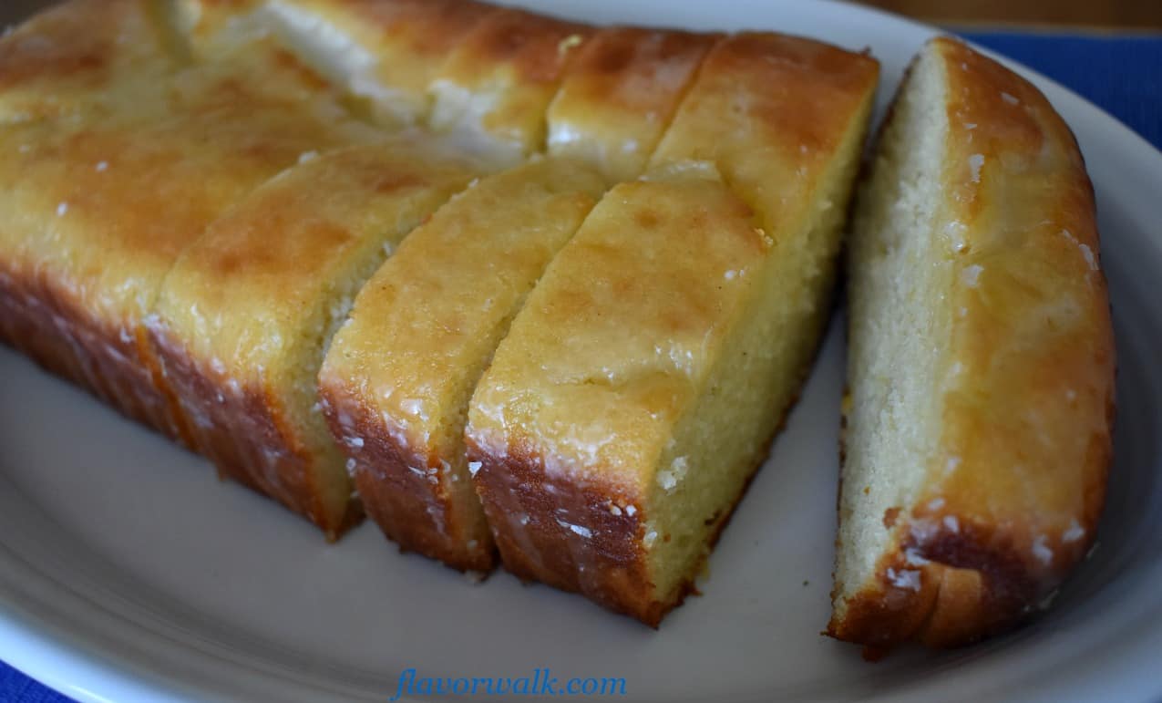 Lemon Loaf Cake with Lemon Glaze on white plate | Flavor Walk