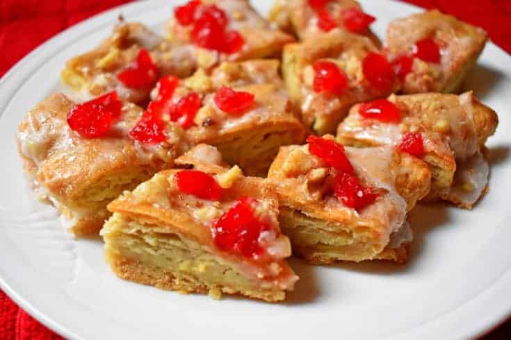 Slices of Festive Holiday Gluten-Free Almond Puff on white plate