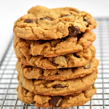Stack of gluten free peanut butter chocolate chip cookies on wire rack