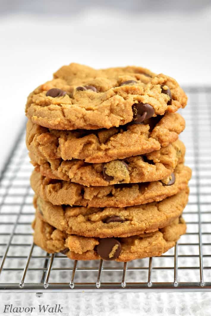 Stack of gluten free peanut butter chocolate chip cookies on wire rack