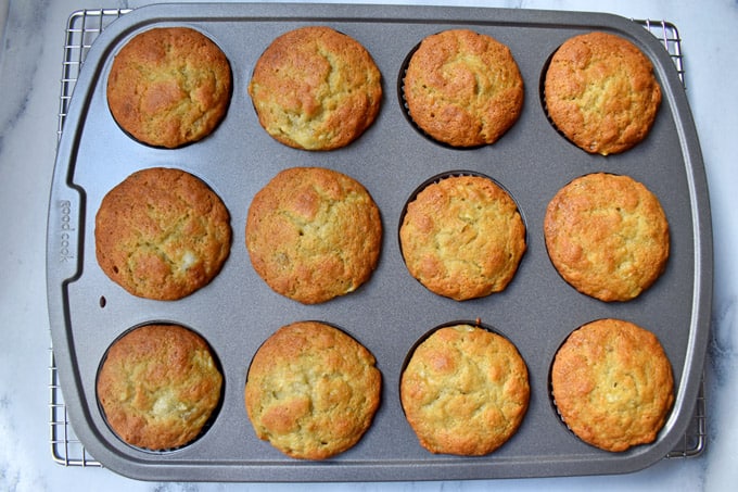 Overhead view of baked gluten free banana muffins in muffin pan