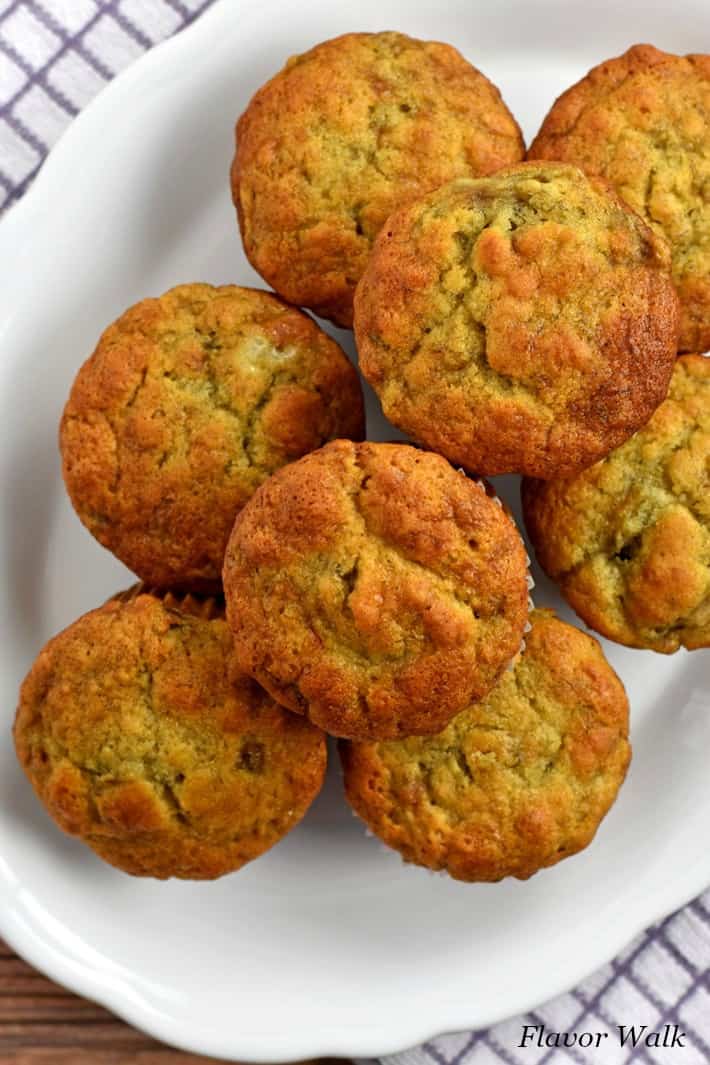 Overhead view of a stack of gluten free banana muffins on a white plate