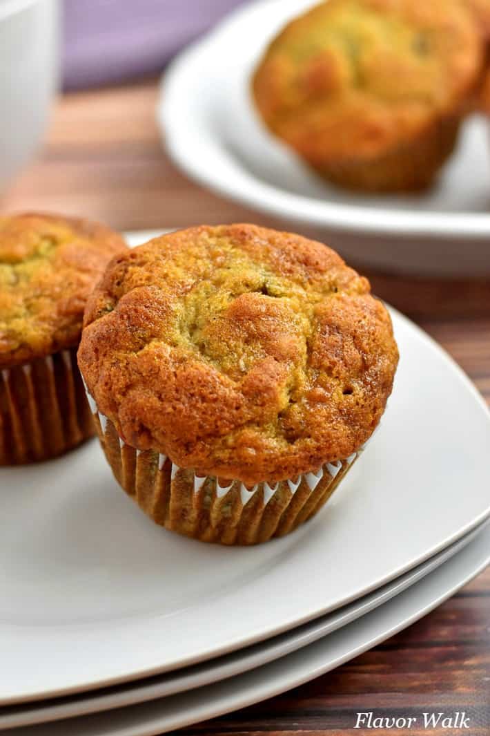 Close-up shot of a gluten free banana muffin on a stack of small white plate