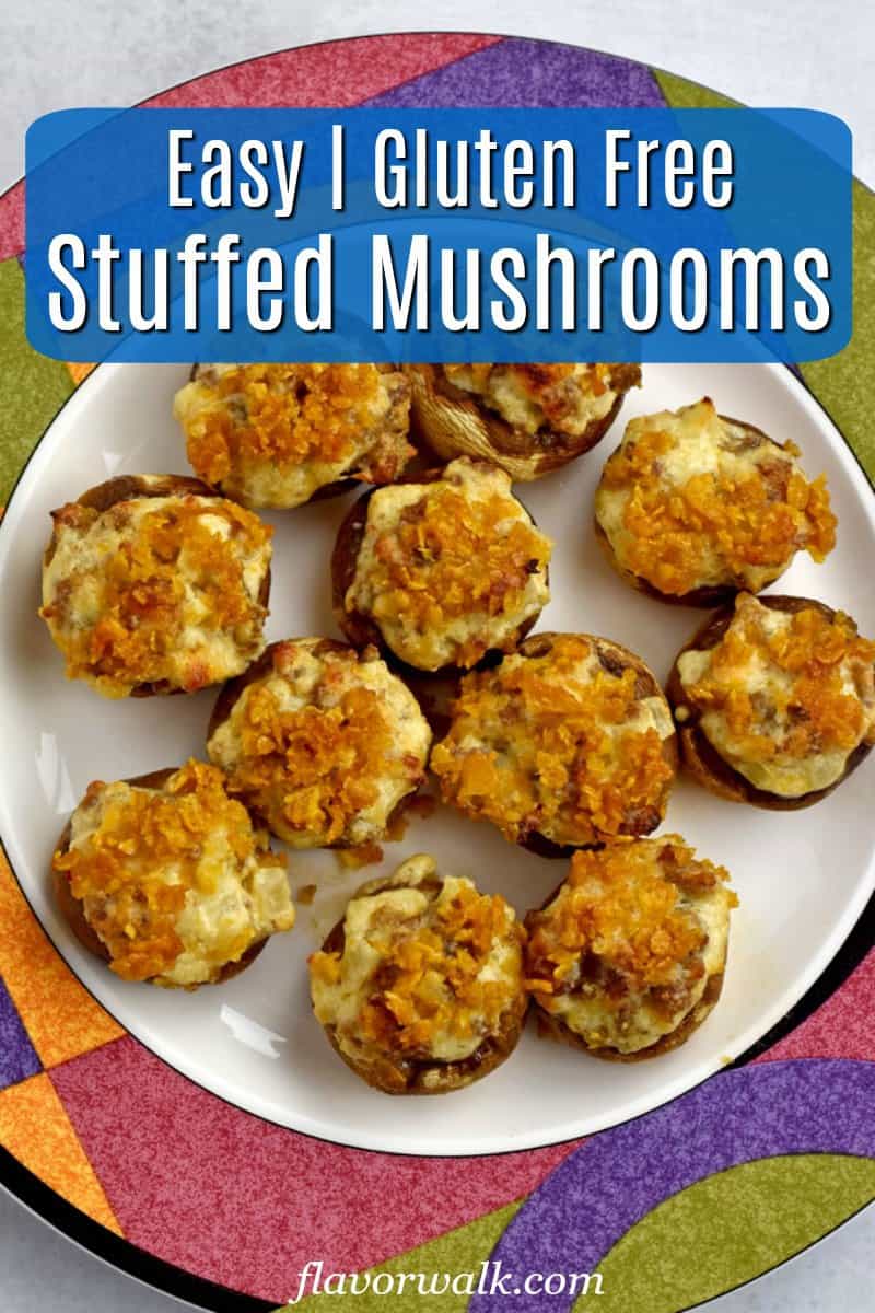 Overhead view of white plate with colorful edge filled with gluten free stuffed mushrooms with blue text overlay near top.