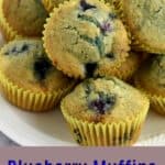 Stack of gluten free blueberry muffins on a white plate with blue and white text overlay at the bottom.