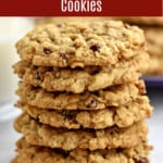 A stack of 7 gluten free cranberry oatmeal cookies on the counter with a glass of milk and a purple plate with more cookies in the background and a red text box at the top.