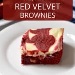 Close up view of one gluten free red velvet brownie on small white plate, more brownies and a blue and white striped kitchen towel in the background, and a red overlay with white text near the top of image.