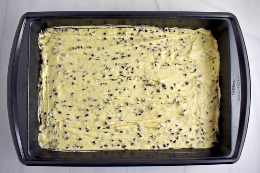 Overhead view of 9 x 13-inch baking pan filled with unbaked gluten free crumb cake batter.
