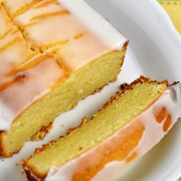 Overhead view of gluten free lemon pound cake on an white, oval, serving plate.