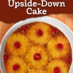 Overhead view of gluten free pineapple upside-down cake on round white plate with text overlay at the top of image.