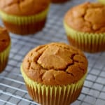 Close up view of gf pumpkin muffins on a wire cooling rack.