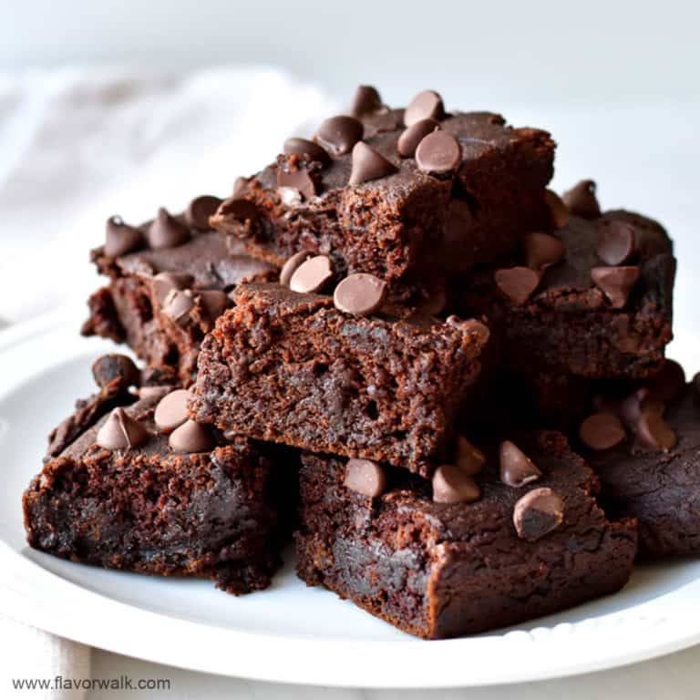 Round white plate filled with gluten free pumpkin brownies.