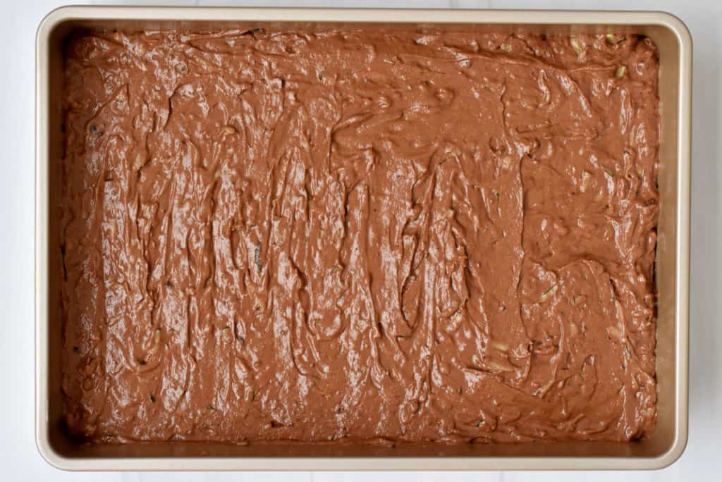 Overhead view of 9x13-inch pan filled with gluten free chocolate zucchini cake batter.