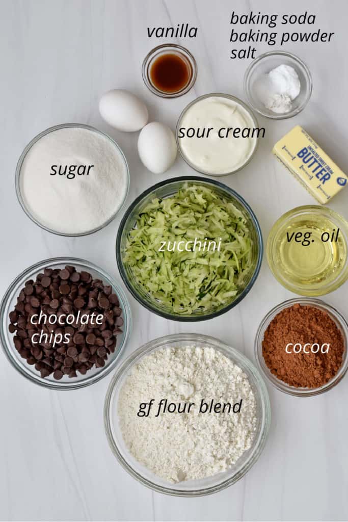 Overhead view of ingredients, with labels, for making gluten free chocolate zucchini cake.