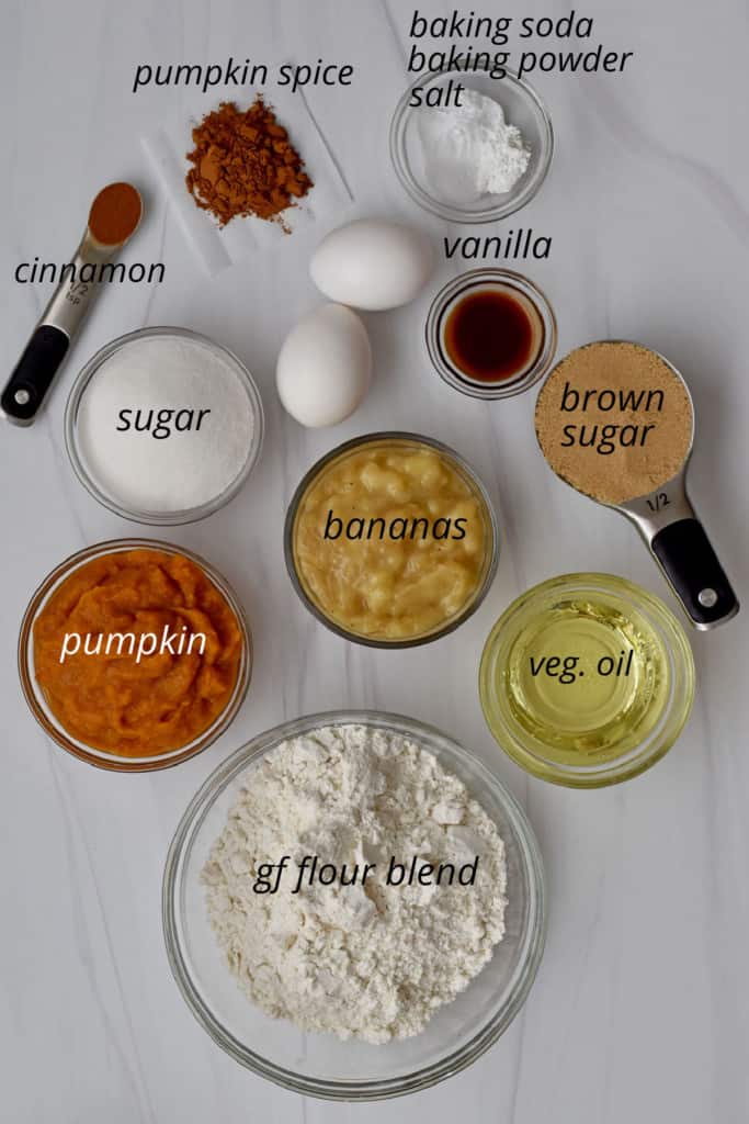 Overhead view of ingredients, with labels, for making gluten free pumpkin banana bread.