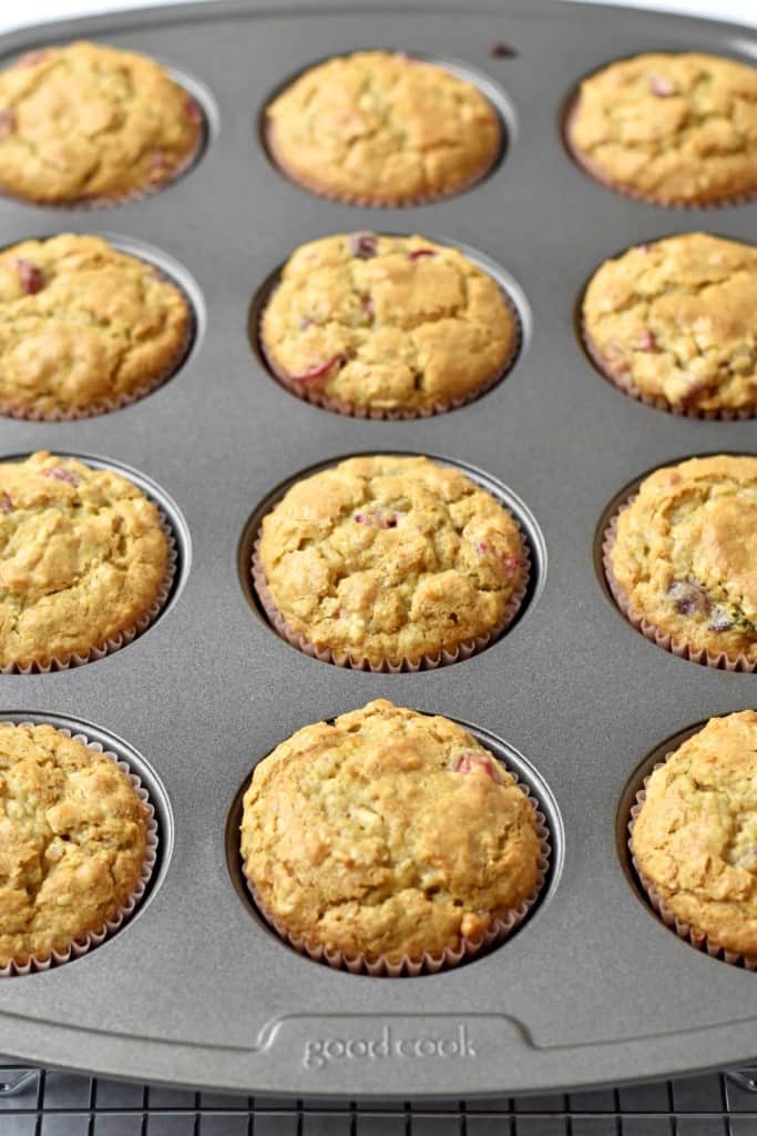 Baked gluten free cranberry oatmeal muffins in muffin pan.