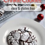 Three gluten free chocolate crinkle cookies on white plate with more cookies in the background. Red, white, and black text overlays near top for Pinterest.