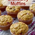 Gluten free cranberry muffins on wire rack with text and overlays near top of image for Pinterest.