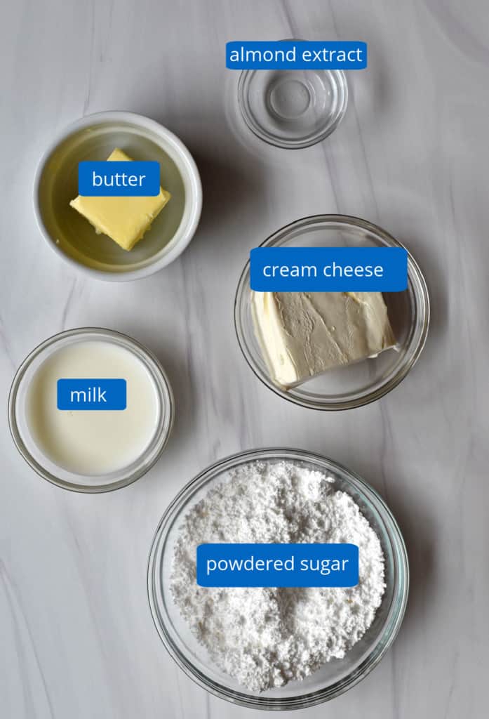 Overhead view of ingredients, with labels, for making a cream cheese glaze.