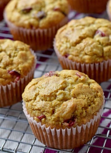 Close up view of gluten free cranberry oatmeal muffins on wire rack.