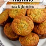 A stack of gluten free banana muffins on a white platter with text overlay, "Banana Muffins, Easy & Gluten Free."
