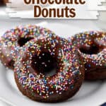 Three chocolate donuts with sprinkles on white dessert plate with text overlay, "Easy & Gluten Free Chocolate Donuts."