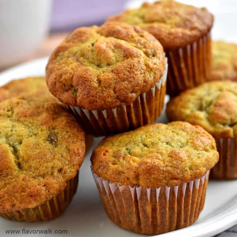 Close-up view of a white platter filled with gluten free banana muffins.
