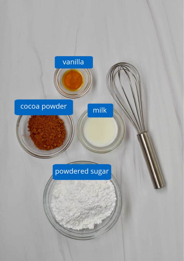 Ingredients, with labels, for making chocolate glaze.
