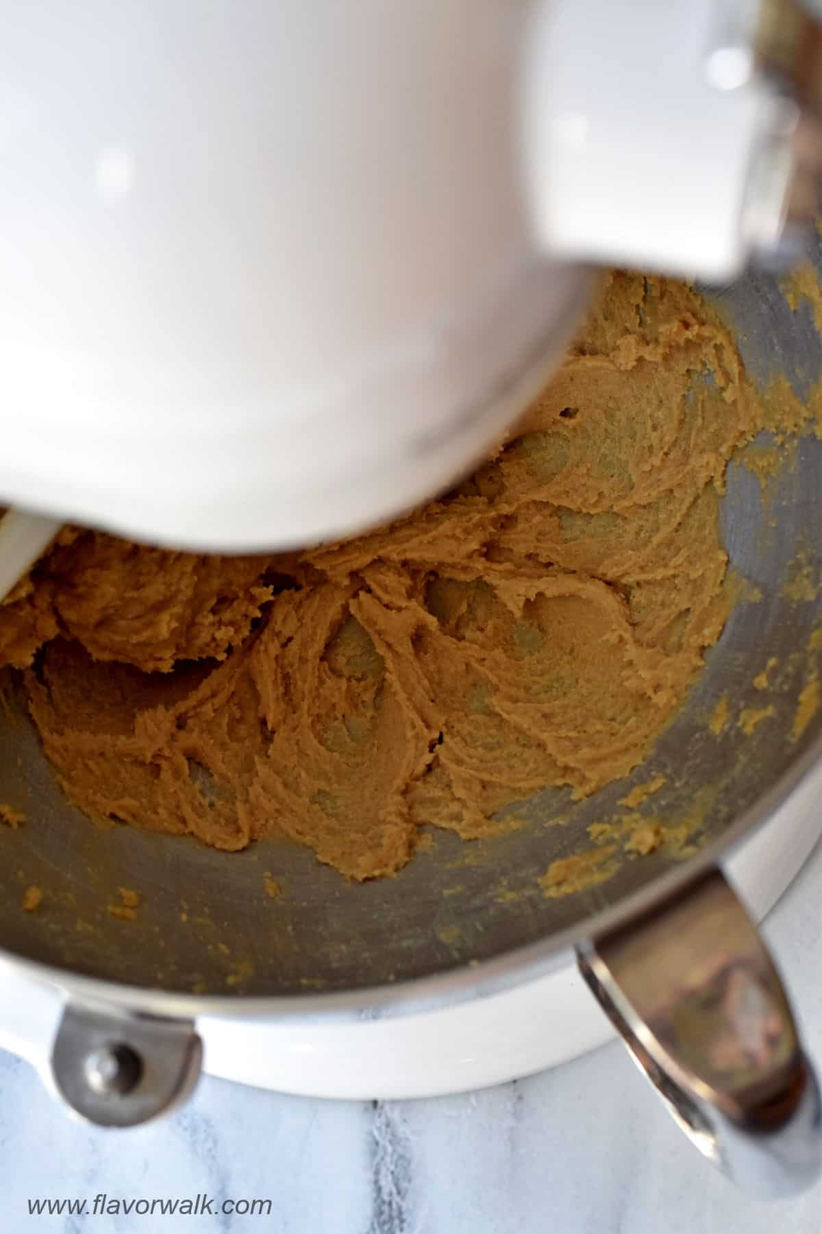 Butter, brown sugar, and vanilla extract creamed together in the bowl of a stand mixer.