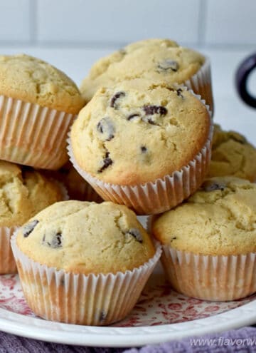 Close up of a plate of chocolate chip muffins.
