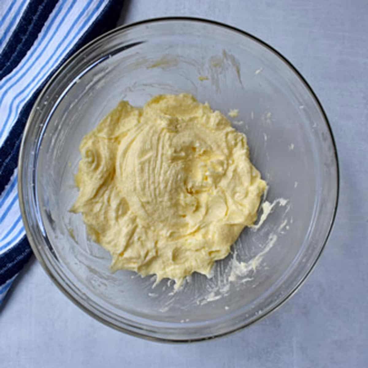 Eggs, baking powder, salt, and vanilla mixed together with creamed butter and sugar in mixing bowl.