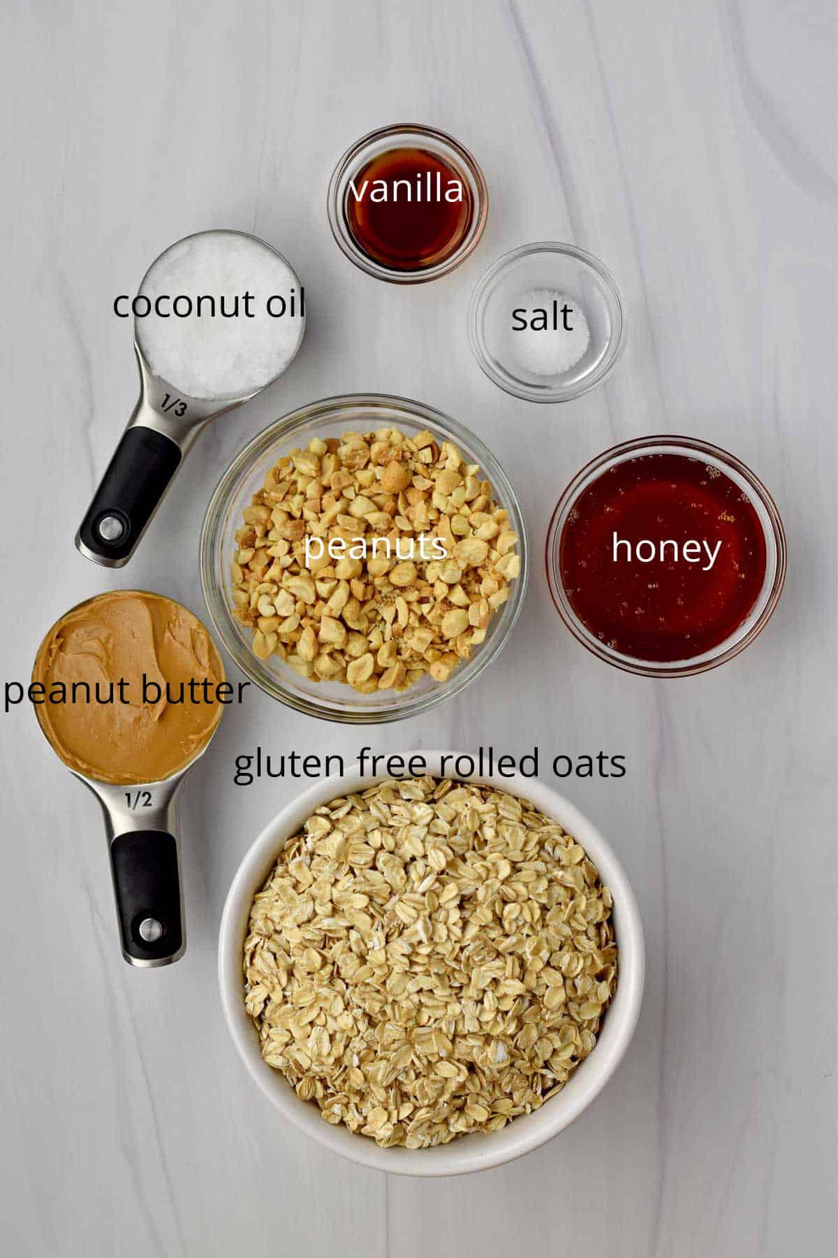 Ingredients, with labels, for peanut butter granola.