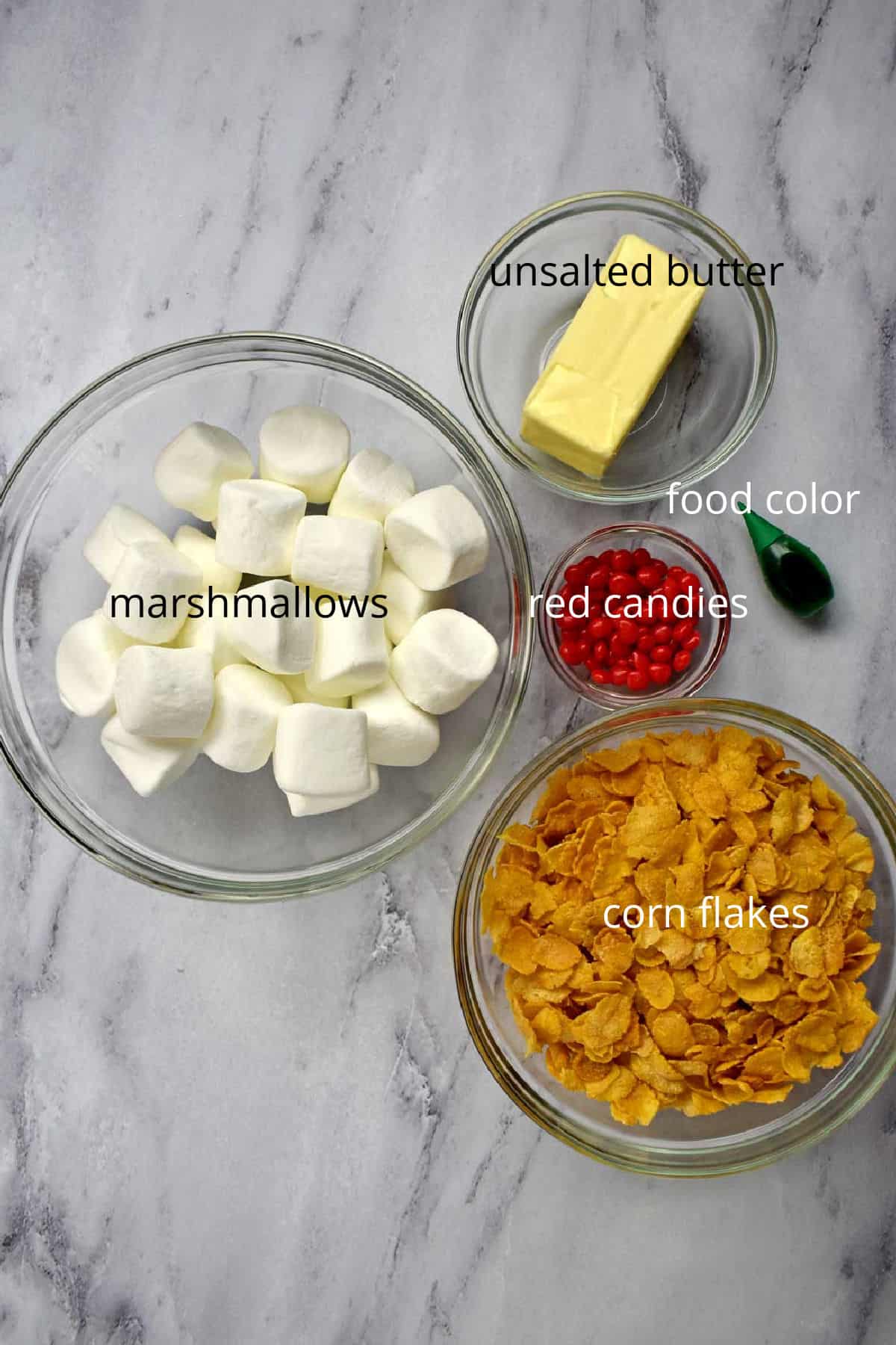 Labeled ingredients for holly cookies on counter.