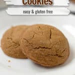 Two gluten free molasses cookies on a small white plate with text overlay, "Molasses Cookies, Easy & Gluten Free."