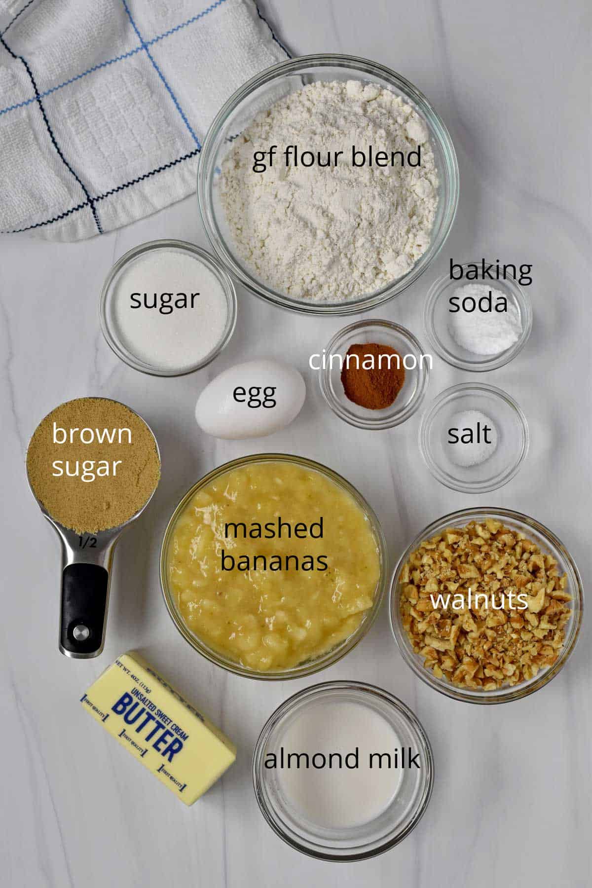 Ingredients, with labels, for gluten free banana nut muffins.