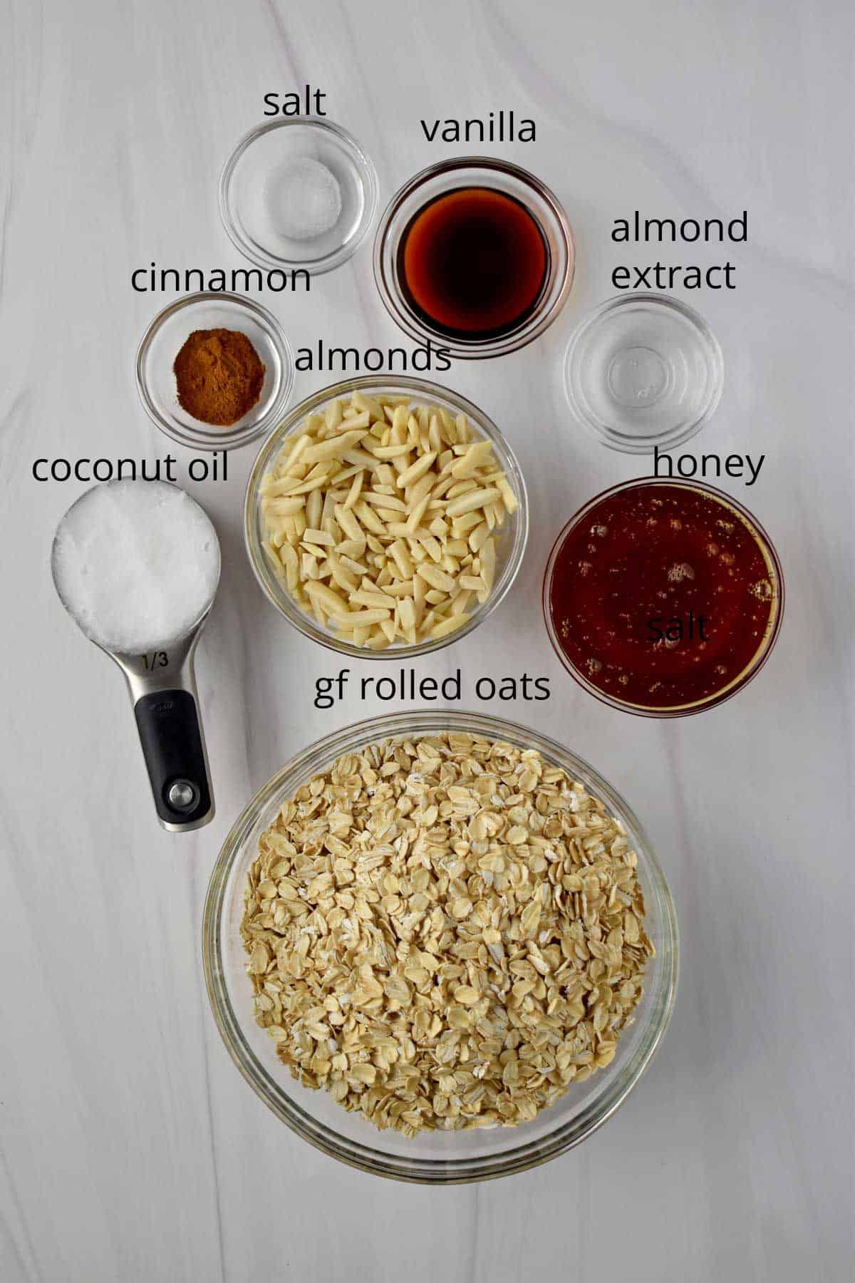 Ingredients, with labels, for vanilla almond granola.