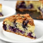 A slice of gluten free blueberry cake on a small white plate with text overlay, "Gluten Free Blueberry Cake."