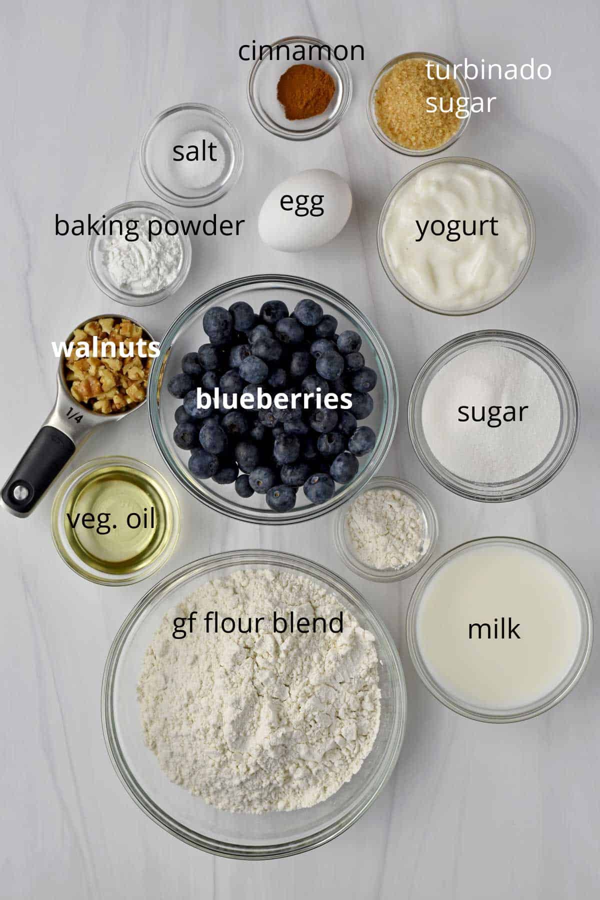 Ingredients, with labels, for gluten free blueberry cake.