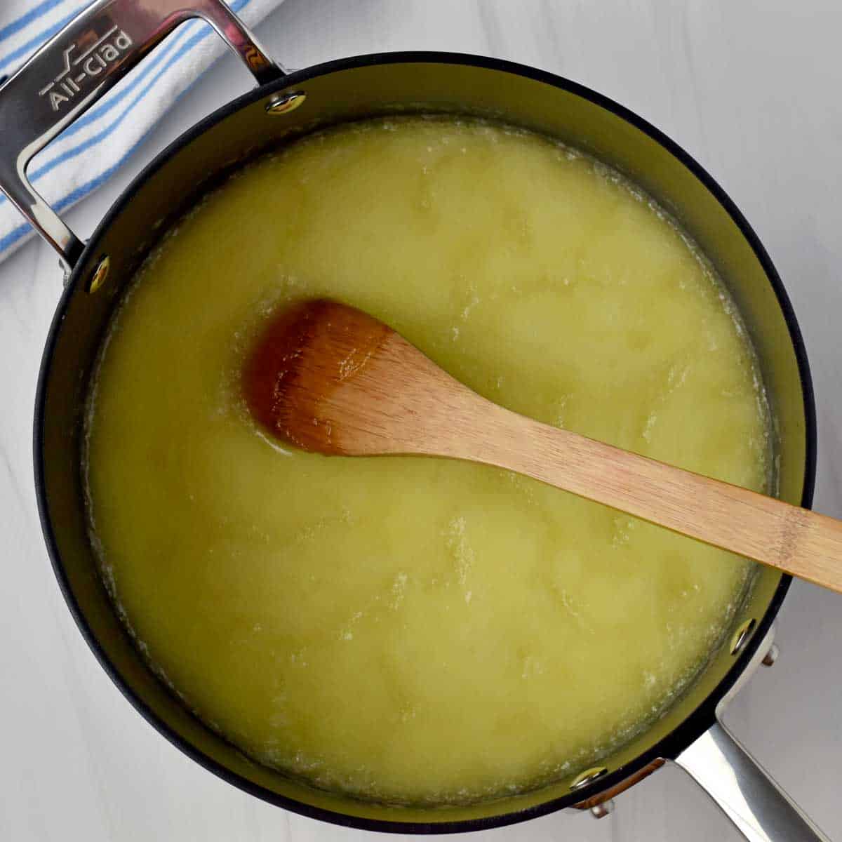 Melted butter and sugar stirred together in saucepan.