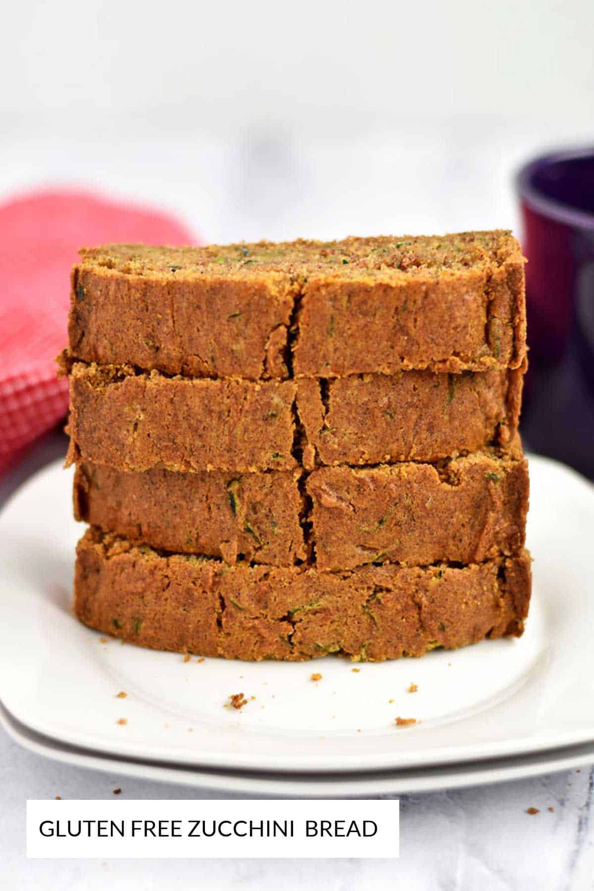 A stack of four slices of gluten free zucchini bread.